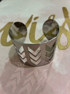 Bracelet silver tone cuff adjustable to 3 inch diameter